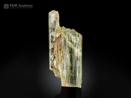 Transparent pale yellow-green triphane spodumene crystal with natural striations from Afghanistan.