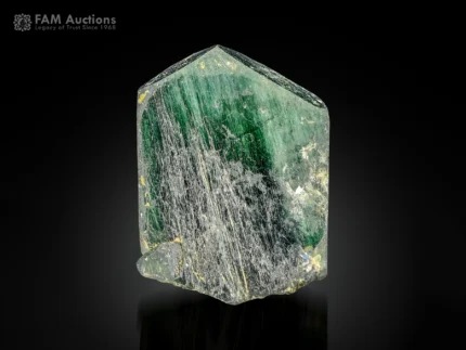 Green apatite crystal with byssolite inclusions and a sharp natural termination.