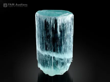 Natural beryl var. aquamarine crystal with blue color and prominent vertical striations.