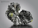Bow-tie epidote crystal cluster with black radiating crystals and subtle green tints.