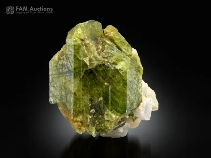 Olive-green diopside crystal associated with white feldspar