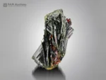 Lustrous black epidote crystals with reddish-brown rutile from Pakistan in a striking mineral association.