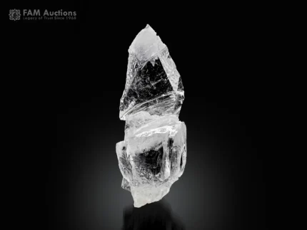 Clear quartz crystal displaying a scepter habit and superb transparency