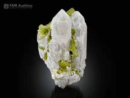 Green tourmaline crystals with sharply terminated quartz crystals on matrix from Pakistan