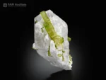 Green tourmaline crystals with sharply terminated quartz crystals on matrix from Pakistan