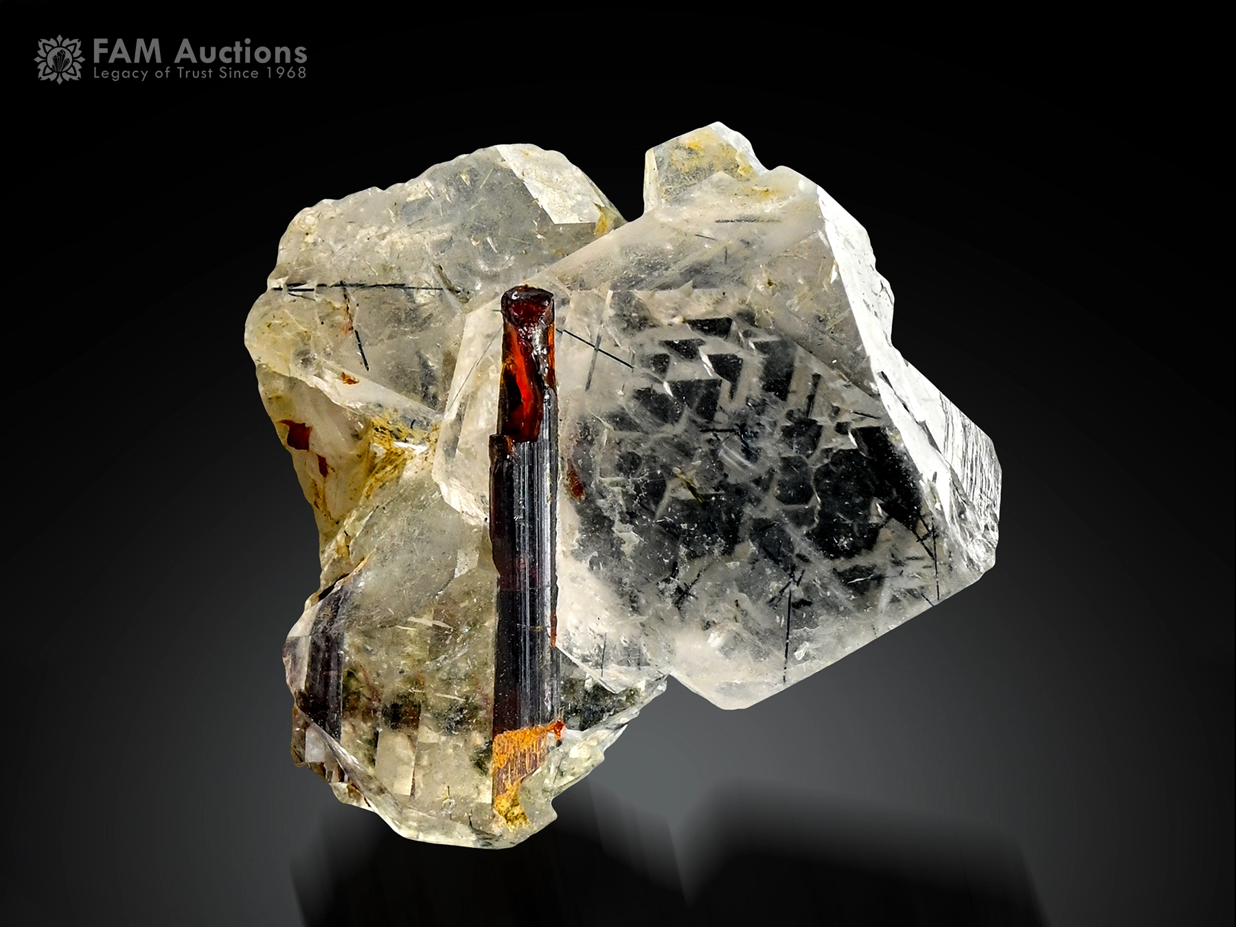 rutile crystal with quartz Rutile crystal on clear quartz with fine rutile inclusions.
