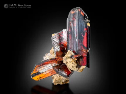 Fiery red brookite with quartz and albite featuring sharp terminations and phantom-like internal features