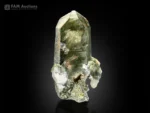 Chlorite included quartz crystal with green inclusions and sharp termination.