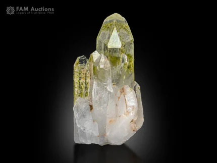 Clear quartz crystal cluster with green chlorite inclusions and sharp terminations