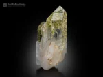 Clear quartz crystal cluster with green chlorite inclusions and sharp terminations