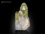 Clear quartz crystal cluster with green chlorite inclusions and sharp terminations
