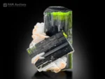 Green cap tourmaline crystal with cleavelandite showing vivid green termination and strong color contrast.