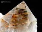 Rutile quartz crystal with golden and copper-colored rutile needles