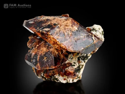 Titanite crystal cluster on albite with honey brown to dark color and attractive luster.