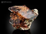 Titanite crystal cluster on albite with honey brown to dark color and attractive luster.