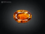 Natural oval cut Sphene featuring rich golden orange color, warm amber tones, and lively brilliance.