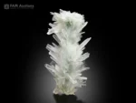 Elongated aragonite specimen with sharp needle-like crystals and subtle chrysocolla from Pakistan.