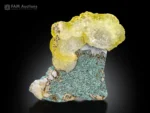 Rounded yellow brucite crystal cluster on green chrysocolla matrix from Killa Saifullah, Pakistan.