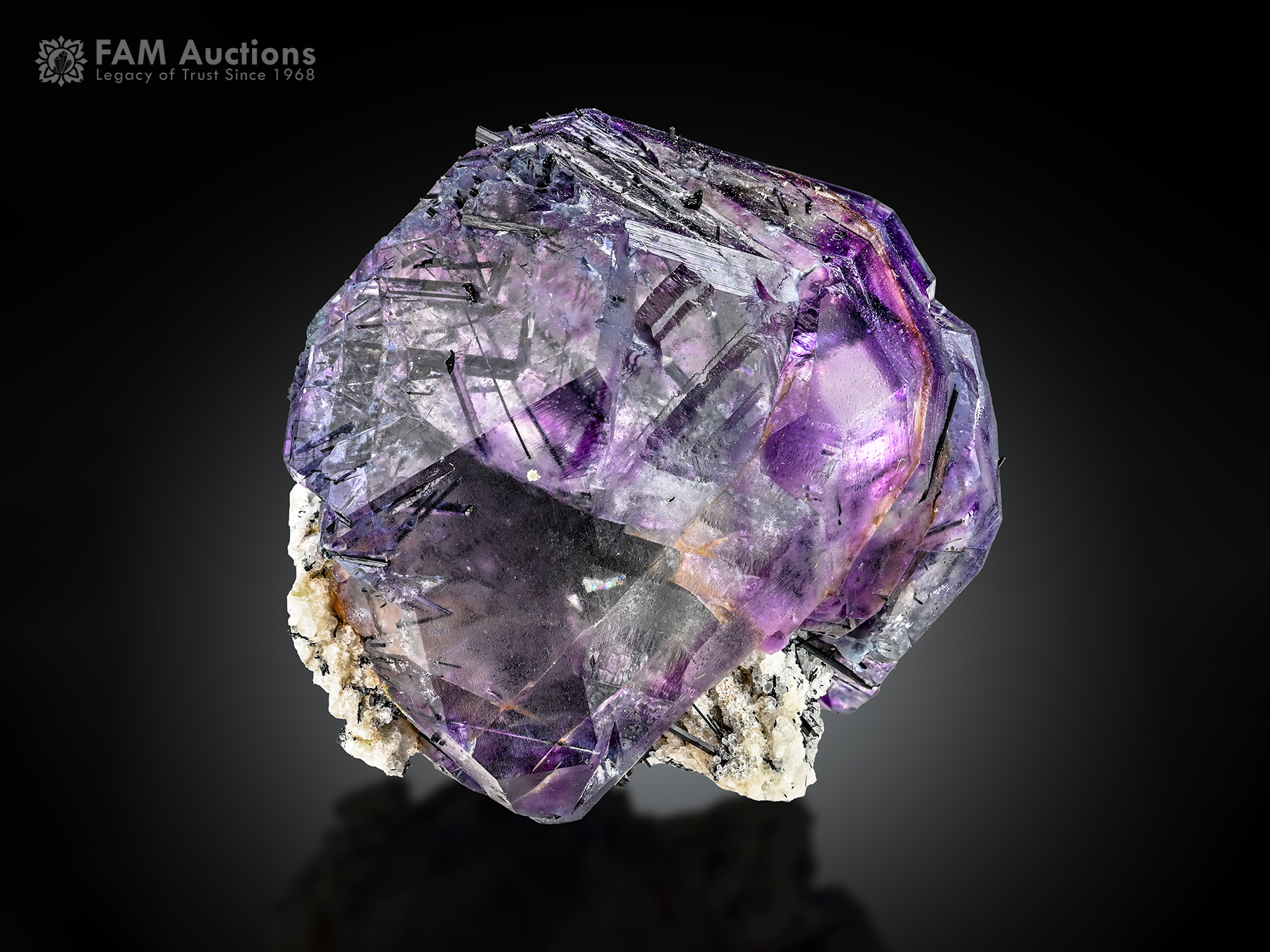 Fluorite Riebeckite Albite Purple fluorite crystals with dark riebeckite inclusions and contrasting albite.