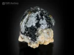 Lustrous hematite crystal cluster with layered metallic faces on pale matrix.