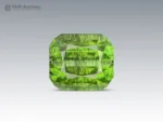 14.35 carat cushion cut green Peridot with dark Ludwigite inclusions from Pakistan.