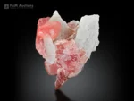 Pink Rhodochrosite crystal group with white Albite from Goand Mine, Pakistan.