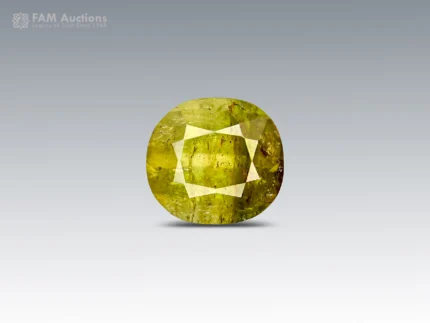 2.35 carat cushion cut tourmaline from Pakistan with green and honey tones, broad facets, and natural inclusions