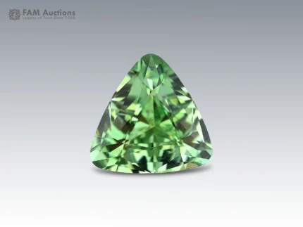 Beautiful 3-carat olive green Tourmaline gemstone from Afghanistan featuring a precision trillion cut, rich green color, excellent clarity, and brilliant faceting.