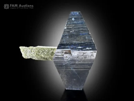 Sharp, lustrous anatase crystal with striking geometric form aesthetically positioned on a chlorite quartz crystal.