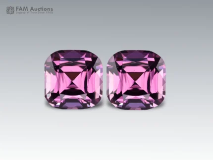 Beautiful pair of lavender spinel gemstones featuring elegant custom cuts, lovely lavender coloration, and brilliant sparkle.