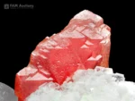 Rich pink rhodochrosite crystal with snowy white cleavelandite and contrasting black schorl.