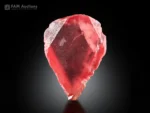 Vivid hot-red rhodochrosite crystal with an elegant shape, sharp edges, a well-defined termination, a gemmy appearance, and brilliant natural luster.
